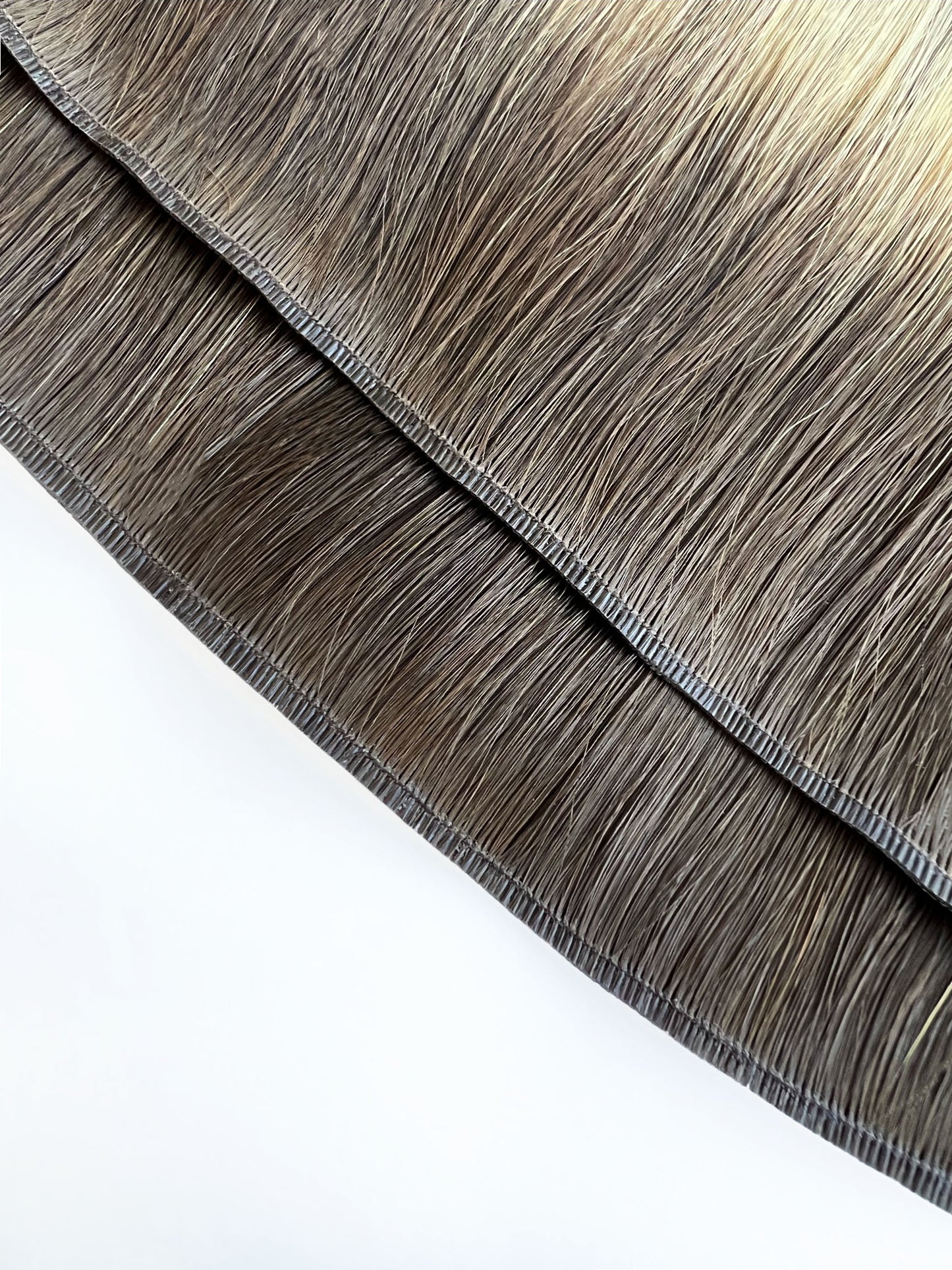 Polyurethane binding of a volume genius weft made from 100% remy human hair sourced from Mongolia. 
